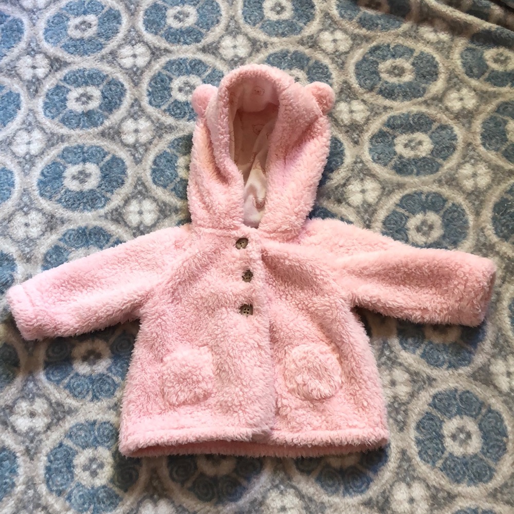 Light pink, fluffy button up sweater.